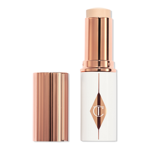 Base en barra hidratante Unreal Skin con acabado luminoso y cobertura ligera