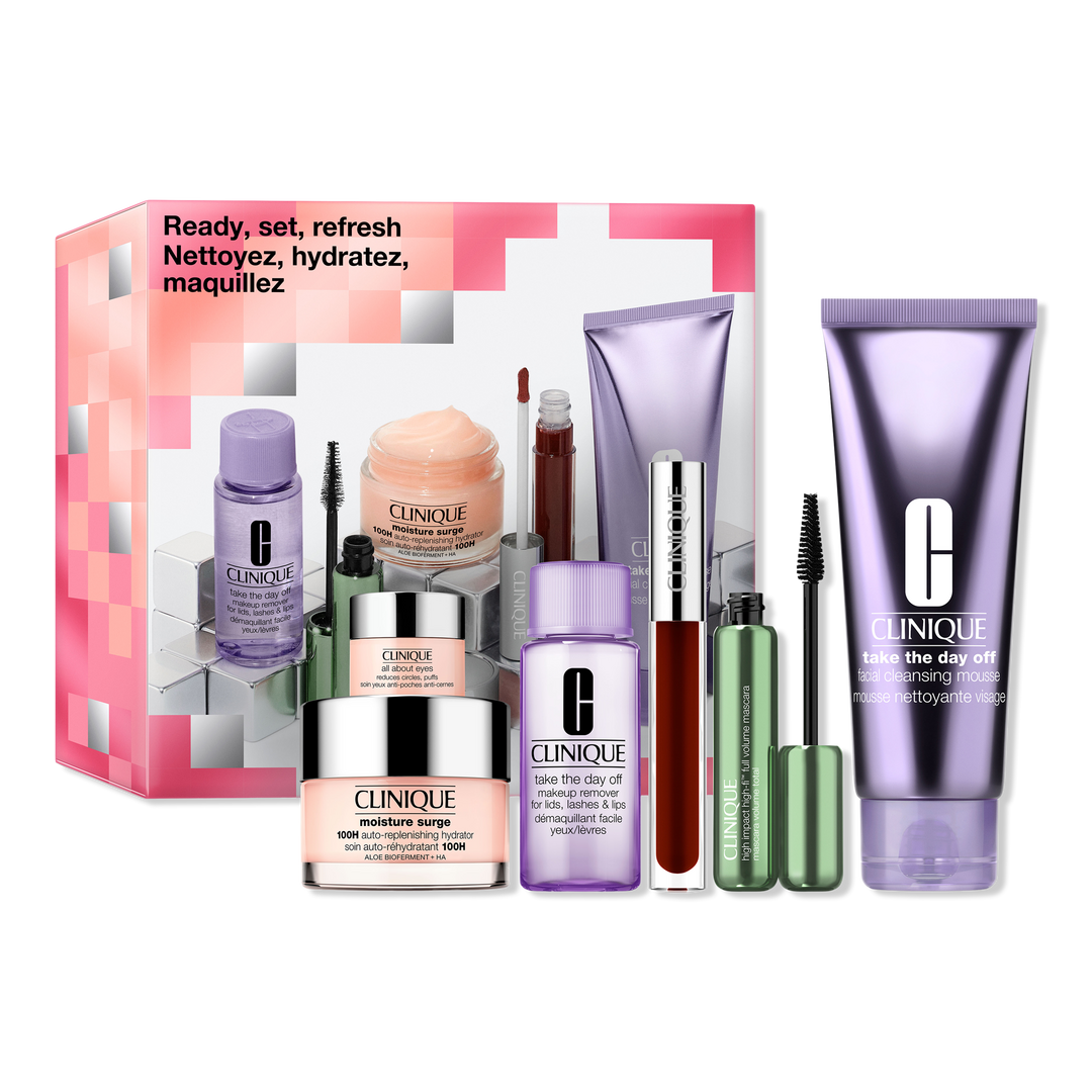 A pink gift set box with six beauty products in front of it